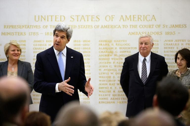 U.S. Secretary of State John Kerry speaks alongside U.S. Ambassador Louis Susman, third from left, during a visit to the U.S. Embassy in London, Monday. Kerry was in London for the first leg of his debut overseas trip &mdash; a hectic nine-country dash through Europe and the Middle East. (Jacquelyn Martin/AP, Pool)