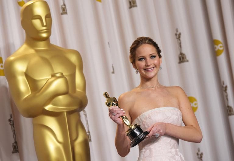Jennifer Lawrence poses with her award for best actress in a leading role for "Silver Linings Playbook" during the Oscars at the Dolby Theatre on Sunday Feb. 24, 2013, in Los Angeles. (John Shearer/Invision/AP)