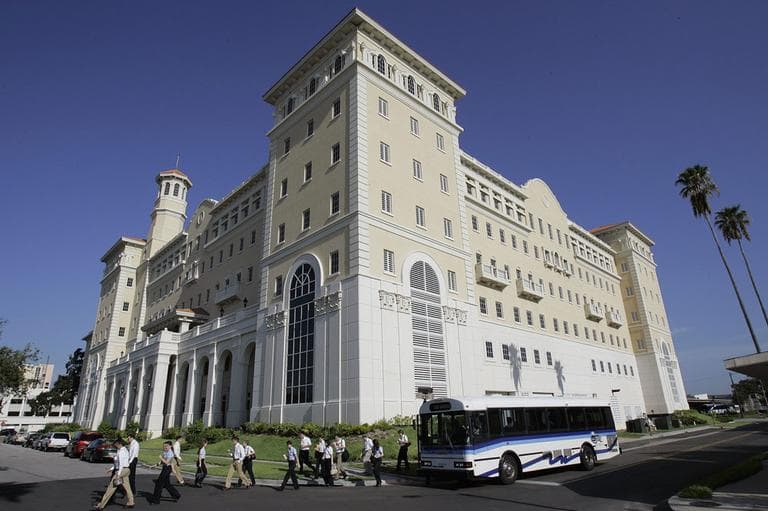 Members of the Church of Scientology walk past the new Flag Building, owned by the church, Aug. 28, 2007 in Clearwater, Fla. (AP)
