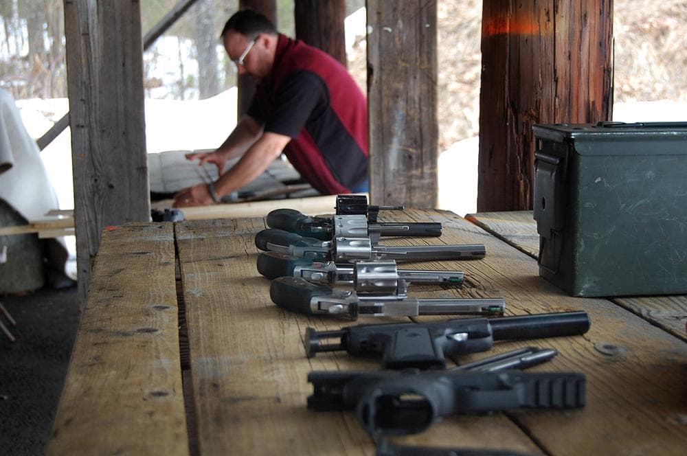 Gun Owners' Action League instructor Jon Green sets up a shooting range for his class at the Worcester Pistol Rifle Club. (Kathleen McNerney/WBUR)