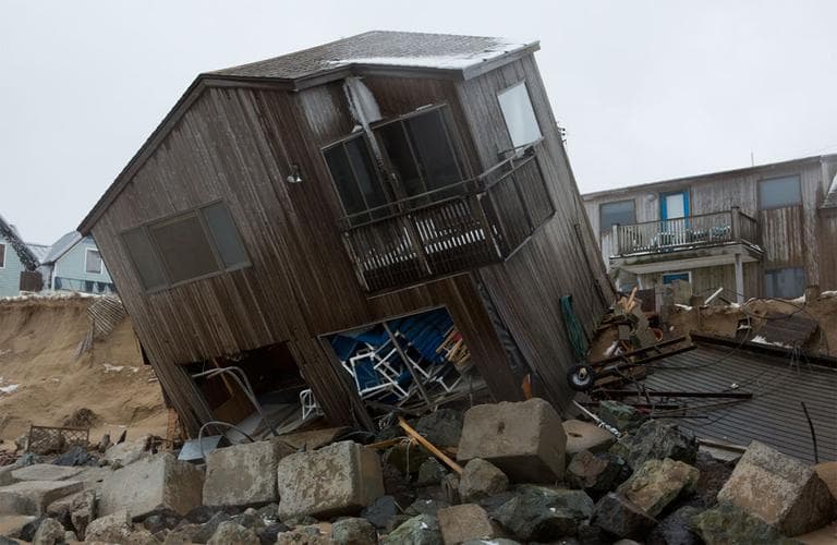 A partially collapsed home on Plum Island Friday afternoon (Jesse Costa/WBUR)