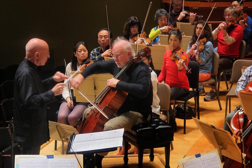 BSO guest conductor Christophe Eschenbach, cellist Lynn Harrell and the BSO during practice. (Andrea Shea/WBUR)