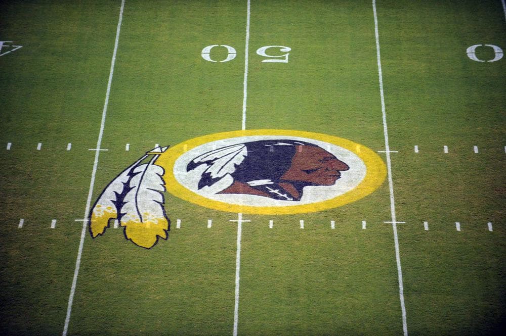 A group of Native Americans is arguing that Washington D.C.'s NFL franchise should lose exclusive rights to the name "Redskins" because it is a racial slur. (Nick Wass/AP)