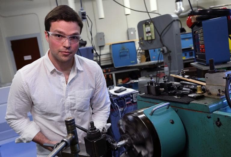 Massachusetts Institute of Technology doctoral candidate in mechanical engineering Nikolai Begg poses in an MIT workshop in Cambridge, Mass., Friday, March 15, 2013. Begg is concerned about whether government funding losses could force undergraduates who are contemplating higher degrees to enter the workforce for financial reasons, meaning a loss of American ingenuity in the end. (Michael Dwyer/AP)