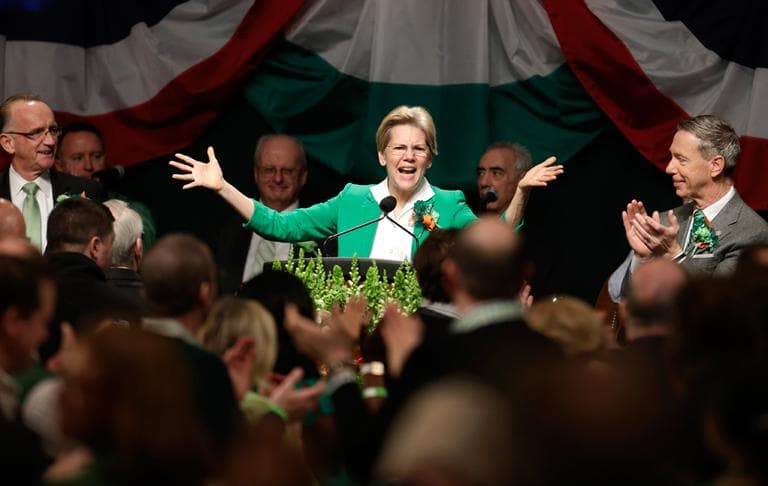 Sen. Elizabeth Warren, spoke at the annual breafkast as Boston City Councilor Bill Linehan, left, and U.S. Rep. Stephen Lynch, right, applaud, Sunday, March 17, 2013. (Steven Senne/AP)