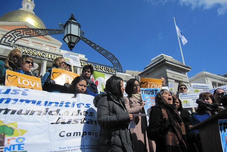 Immigration advocates rally on the State House steps Wednesday. (Asma Khalid/WBUR)