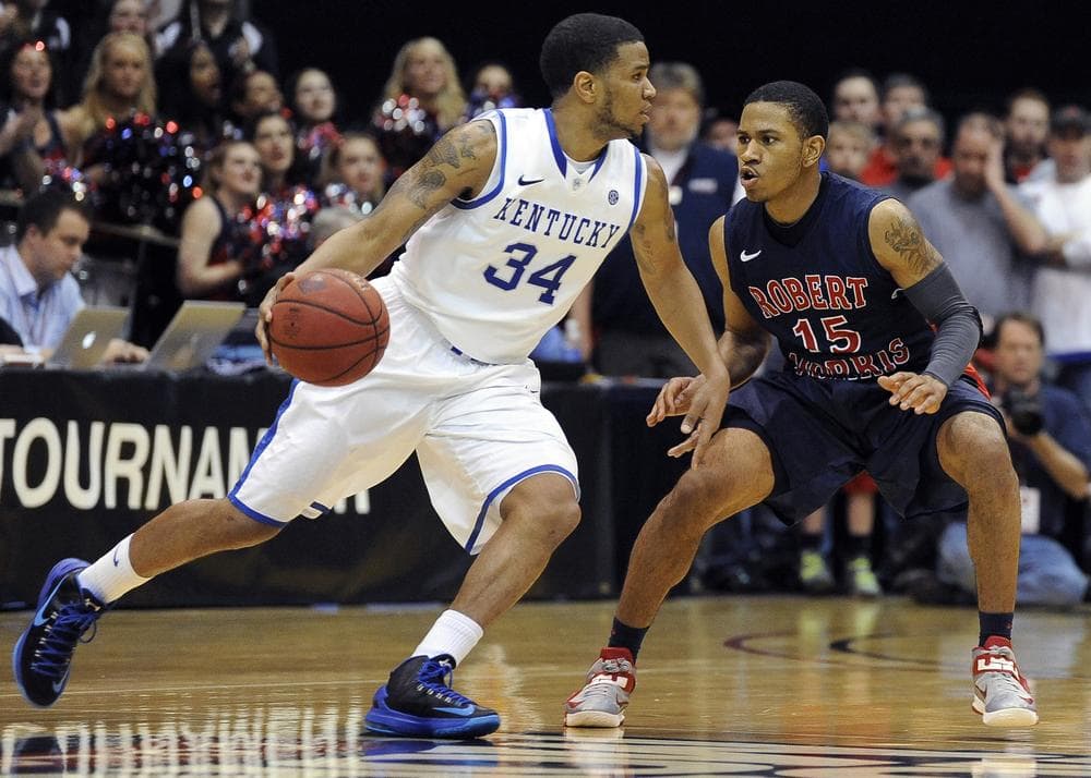 Julius Mays (left) and the Kentucky Wildcats couldn't get past Robert Morris and Karvel Anderson in the first round of the NIT. (Don Wright/AP)