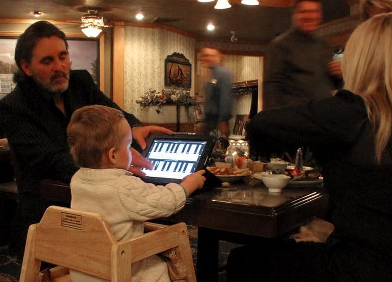 "This child and his parents were seated at the table next to ours at a restaurant last evening... His parents worked hard to keep him occupied but nothing seemed to last beyond a minute or two until... the iPad appeared." (Dick Jensen/Flickr)