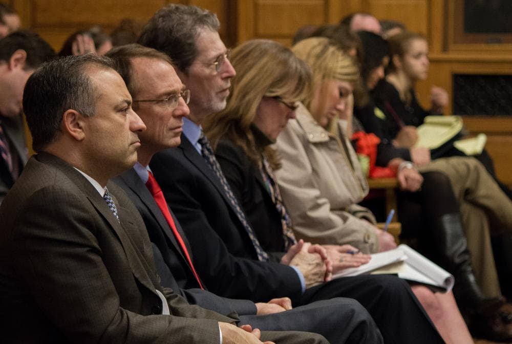 Anthony Benedetti, foreground, chief counsel for the Committee for Public Counsel Services, observes the single justice hearing on Wednesday. (Joe Spurr/WBUR)