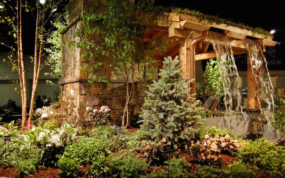 Ahronian Landscaping &amp; Design of Holliston and Medway Garden Center of Medway includes a waterfall atop outdoor seating for "privacy" and to "drown out background noise." (Greg Cook)