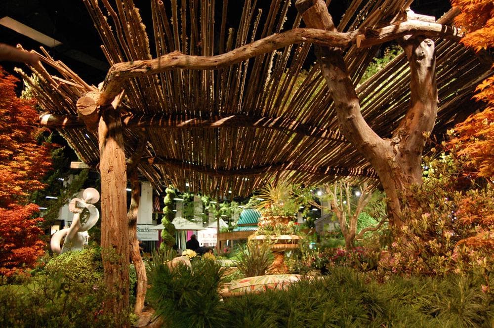 Miskovsky Landscaping of Falmouth places outdoor seating under a pergola. (Greg Cook)