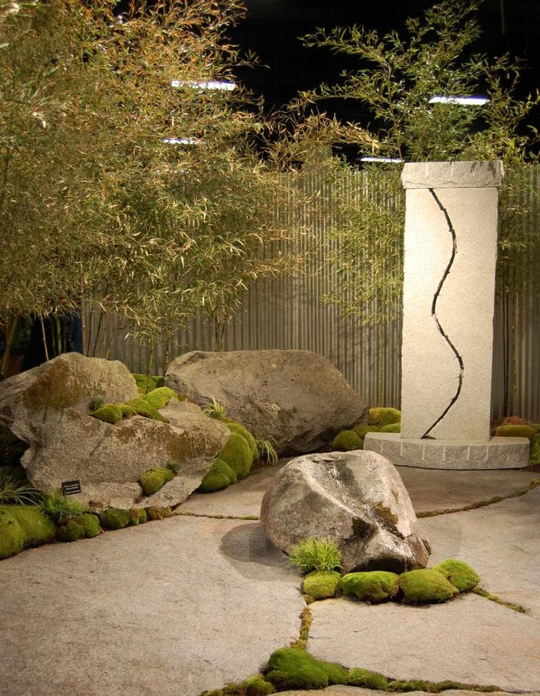 Water flows down a boulder in a rock and bamboo garden by New England Land Artisan of Stratham, New Hampshire. (Greg Cook)