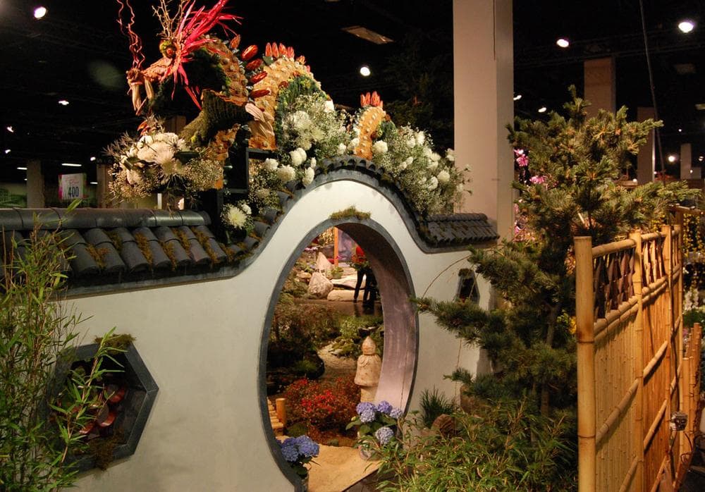 Green Animals Topiary Garden in Portsmouth, Rhode Island, fashioned a dragon out of moss, magnolia leaves, berries, palm fronds, willow branches and flowers in the Newport Flower Show's display. (Greg Cook)