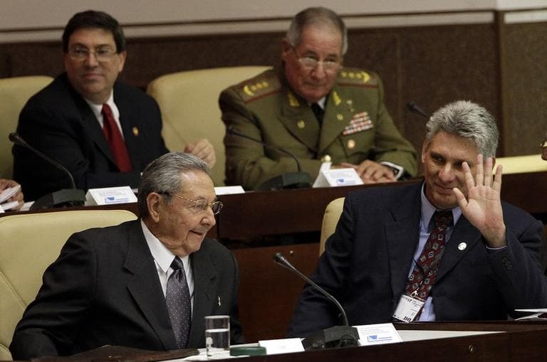 Cuba's new Vice President Miguel Diaz-Canel, right, waves, sitting next to Cuba's President Raul Castro, during the closing session at the National Assembly in Havana, Cuba, in 2012. (AP/Ismael Francisco, Cubadebate)