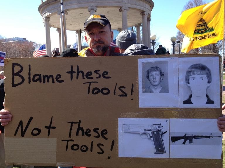 At a rally on Boston Common Wednesday, a self-described "concerned citizen" and father said murderers, not weapons, should take the blame for killings. (State House News Service)