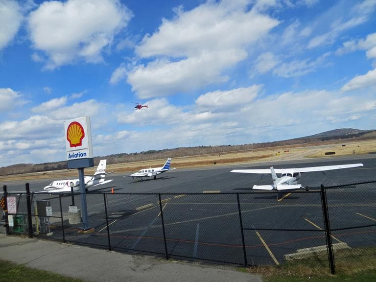 A red WCVB news helicopter prepares to land at Norwood Airport. (Bruce Gellerman/WBUR)