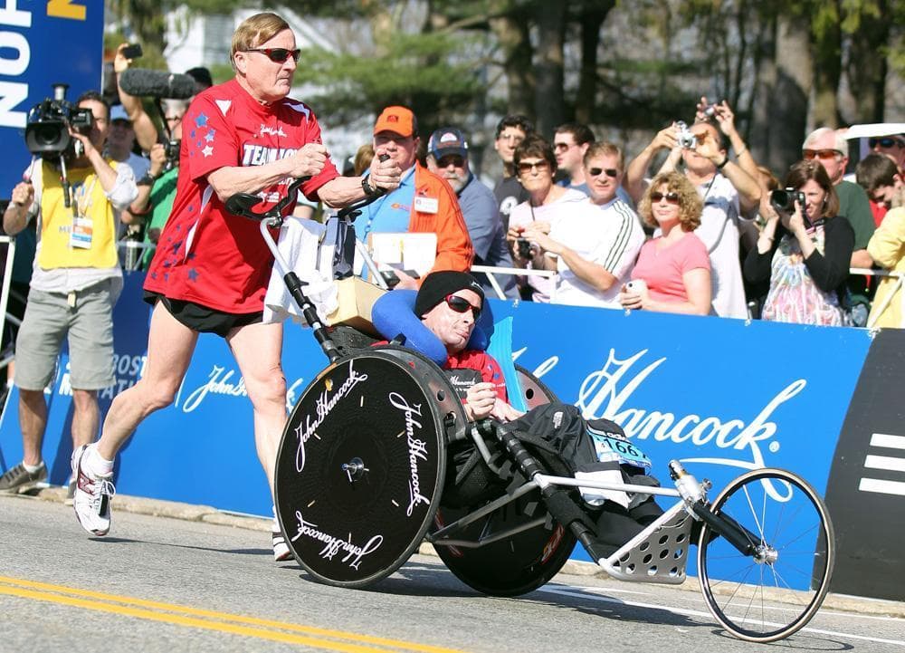 Dick Hoyt, left, and his son, Rick, start the 116th running of the Boston Marathon in Hopkinton, April 16, 2012. (Stew Milne/AP)