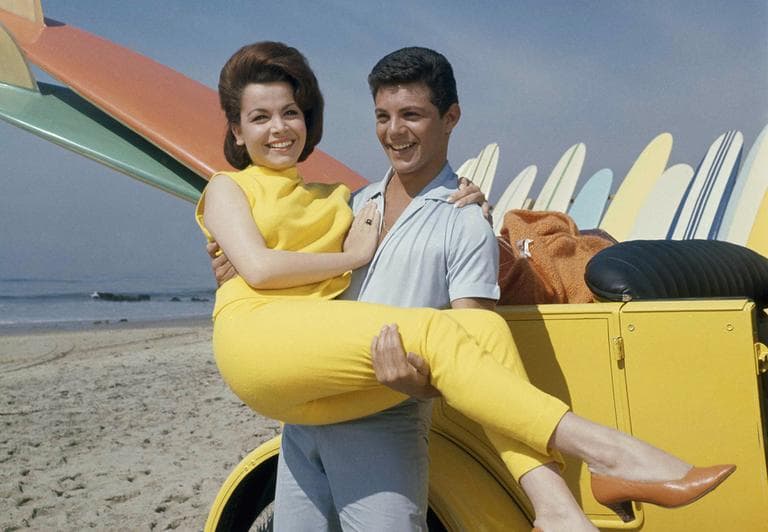 In this 1963 photo, singer Frankie Avalon and actress Annette Funicello are seen on Malibu Beach during filming of "Beach Party," in California in 1963. (AP)