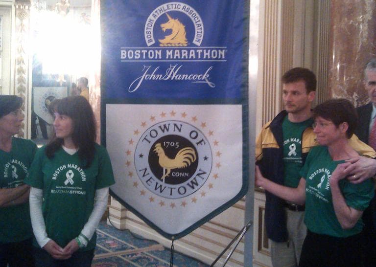 A group of parents from Newtown, Conn. are running the marathon in memory of the 26 people killed in the mass shooting there in December. Laura Nowacki (far right) says "We're all parents. We're Sandy Hook parents. We're also runners and we are here to run 26 miles for 26 lives." (Alex Ashlock/Here &amp; Now)