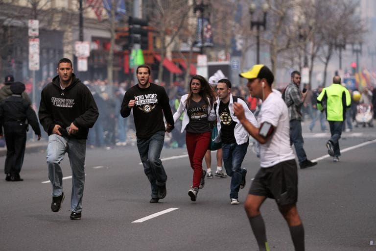 In this photo provided by The Daily Free Press and Kenshin Okubo, people react to an explosion at the 2013 Boston Marathon in Boston, Monday, April 15, 2013. (The Daily Free Press, Kenshin Okubo/AP)