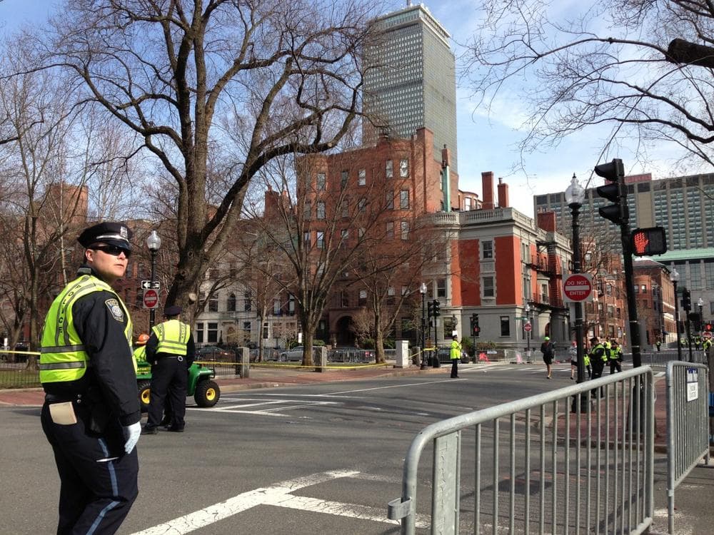 Police seal off marathon route at Hereford and commonwealth and move everyone out of the area. (Robin Lubbock/WBUR)