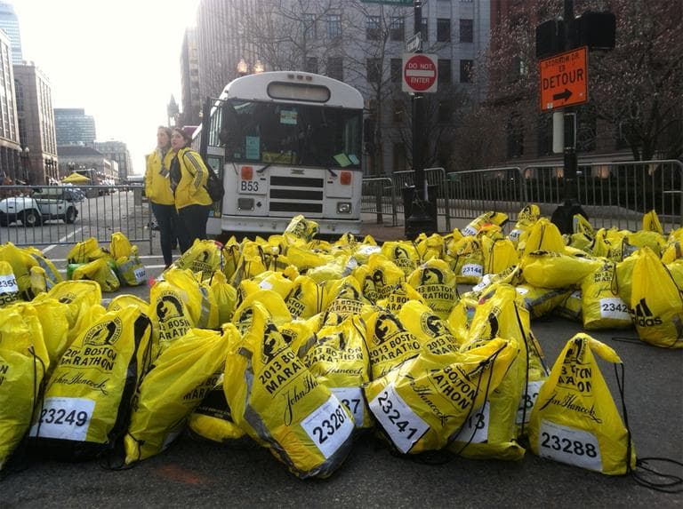 Runners belongings piled up at the corner of Boylston and Berkeley Streets. (Steve Brown/WBUR)