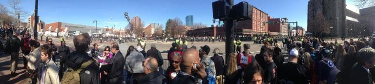 A crowd lines up outside the Cathedral of the Holy Cross in Boston’s South End. Thursday. (Jesse Costa/WBUR)