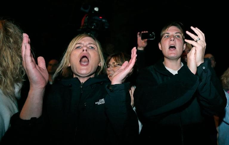 Woman applaud in Watertown