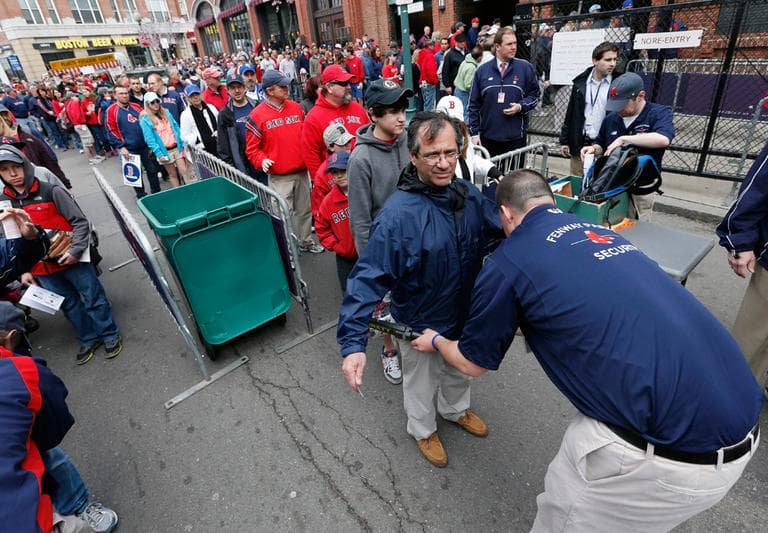 Fans pass through security before entering Fenway Park for a baseball game between the Boston Red Sox and the Kansas City Royals in Boston, Saturday, April 20, 2013. ( Michael Dwyer/AP)
