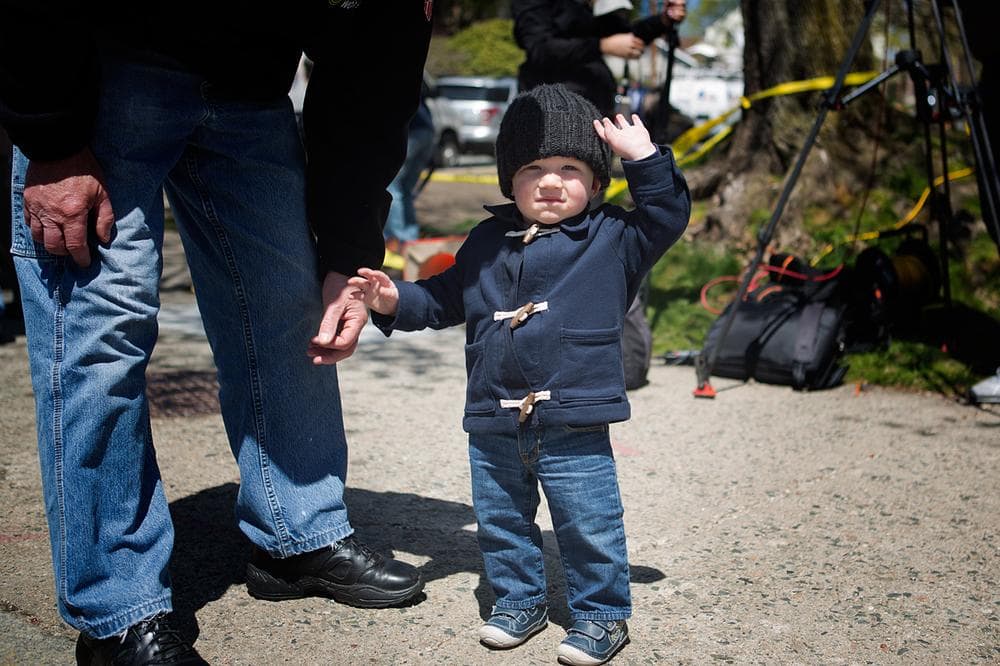 Grayson Sheehan, 15 months old, from Arlington, waves goodbye (Jesse Costa/WBUR)