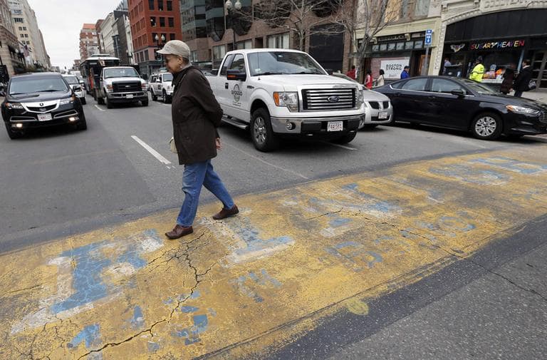 Traffic moves down Boylston Street past the Boston Marathon finish line on Wednesday. (Michael Dwyer/AP)