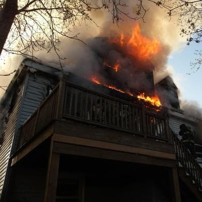Firefighters responded to a multiple-alarm fire in Allston on Sunday. One person died and 15 were injured. (Boston Fire Department)