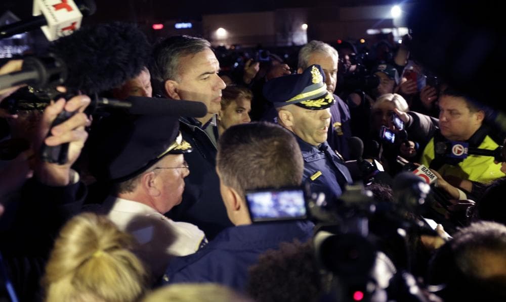 Officials brief the media on a standoff in Watertown, Mass., Friday, April 19, 2013. Authorities say one of two suspects in the Boston Marathon bombing is dead and a massive manhunt is underway for another in the Boston suburb of Watertown early Friday morning April 19, 2013.  (AP Photo/Julio Cortez)