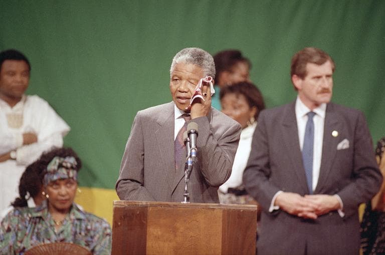 Mandela wipes his brow in the hot, humid gymnasium of the Madison Park High School in Roxbury. (Jim Gerberich/AP)