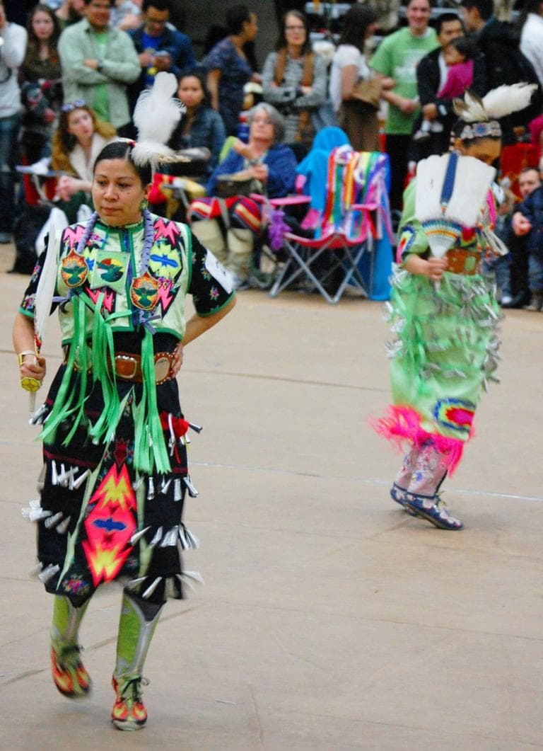 The jingle dress dance is characterized by the ringing of tin cones sewn onto the women's dresses. The sound is "meant to ward off evil spirits," organizers say. (Greg Cook)
