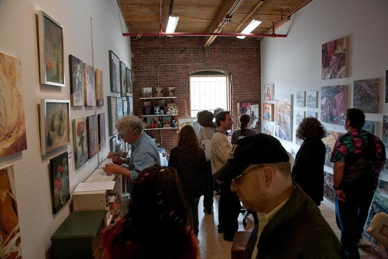 Visitors in a Somerville artist's studio during SOS 2012. (Aram Comjean)