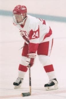 In 1995, Travis Roy was a promising 20-year-old hockey star. In this photo he lines up for a face-off, right before the accident that would change his life. Eleven seconds into the game, he cracked his fourth vertebra and was paralyzed from the neck down. (Courtesy)