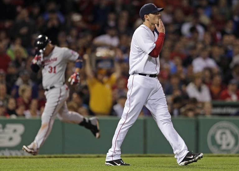  John Lackey walks back to the mound as Twins' Oswaldo Arcia rounds the bases on a two-run, home run during the sixth inning Thursday night. (Charles Krupa/AP)