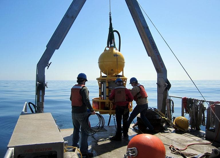 This April 28, 2013 photo released by Woods Hole Oceanographic Institution shows a robotic device being deployed to detect red tide in the Gulf of Maine. (Isaac Rosenthal, Woods Hole Oceanographic Institution & Northeastern University/AP)