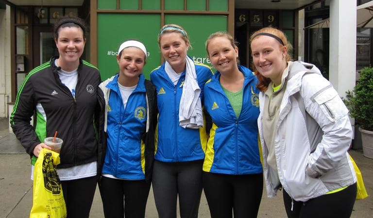 Recent graduates from Saint Anselm College in Manchester, N.H. finished the last mile of the Boston Marathon on Saturday, May 25, 2013 during OneRun. (Amanda Art/WBUR)
