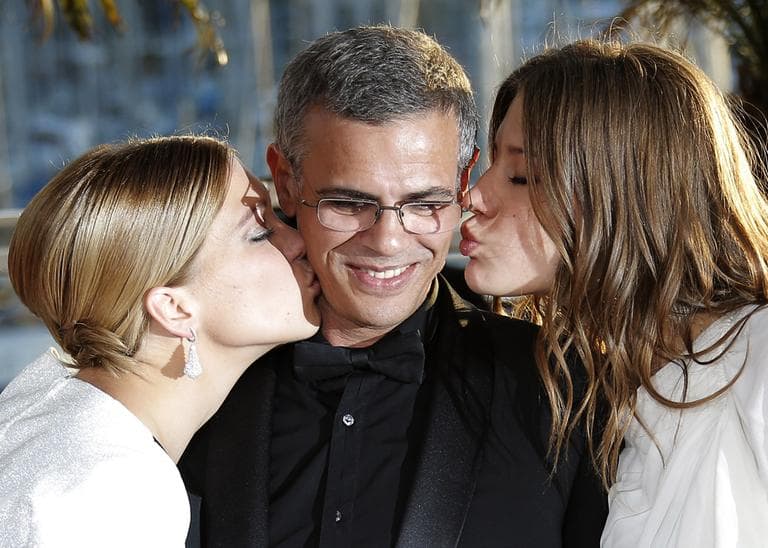 Actress Lea Seydoux, left, director Abdellatif Kechiche, centre, and Adele Exarchopoulos pose with the Palme d'Or award for the film La Vie D'Adele after an awards ceremony at the 66th international film festival, in Cannes, southern France, Sunday, May 26, 2013.  (Lionel Cironneau/AP)