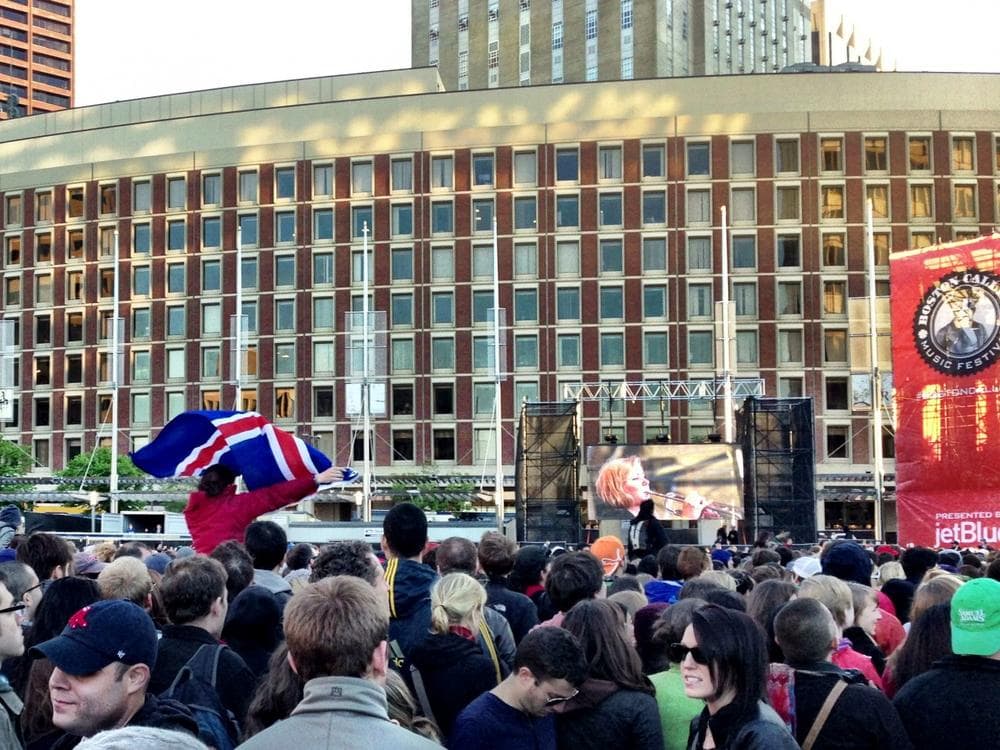 A fan waves an Icelandic flag for the Icelandic group, Of Monsters And Men. (Emma-Jean Weinstein/WBUR)
