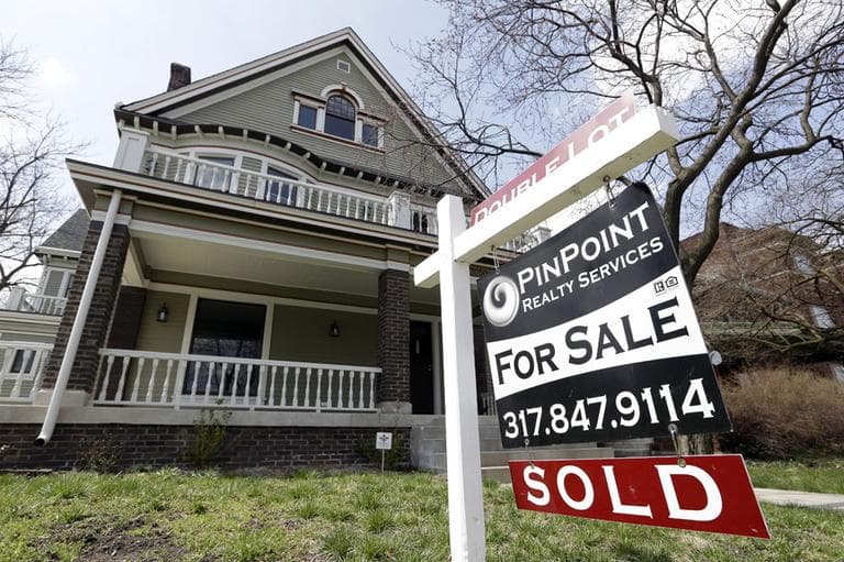 A "Sold" sign is posted outside a home in Indianapolis, Tuesday, April 9, 2013.