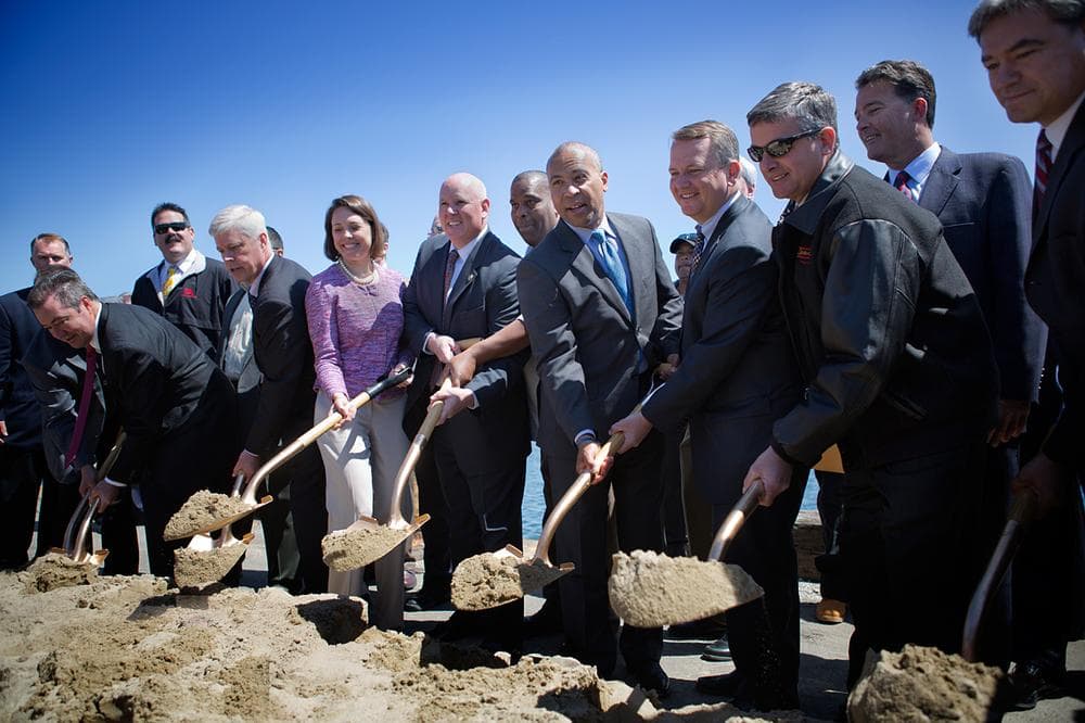 Gov. Deval Patrick and Lt. Gov. Timothy Murray join union representatives during the ground-breaking ceremony for the New Bedford Marine Commerce Terminal. (Jesse Costa/WBUR)