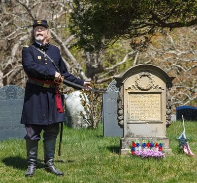 Dale Julius points out the grave of Francis Davis Millet, an East Bridgewater resident who drowned in the Titanic Disaster, 1912. (Courtesy of Jim Weidenfeller)