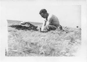 Army Capt. Norval Carter digging a foxhole during training exercise, May 1944. This is one of the last known photographs of him. (Courtesy)