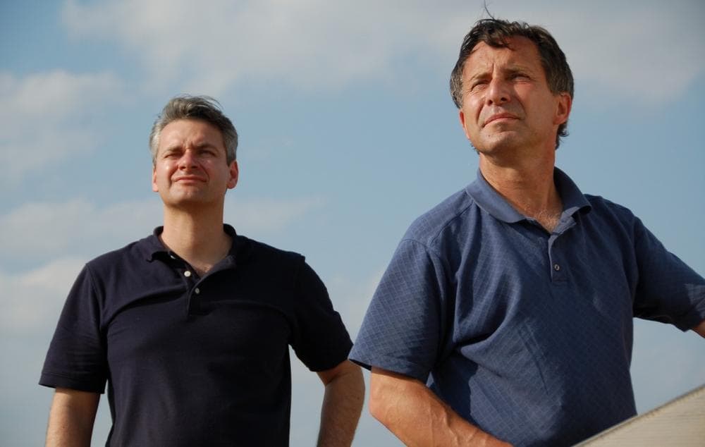 This undated photo provided by The Discovery Channel shows Carl Young, left, and Tim Samaras watching the sky. (Discovery Channel via AP) 