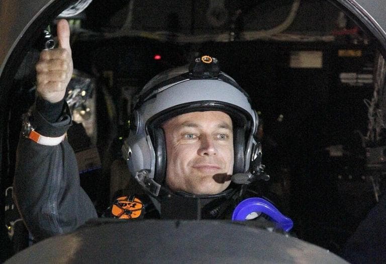 Bertrand Piccard, pilot of the Solar Impulse plane, gives a thumbs up before taking off on a multi-city trip across the United States from Moffett Field NASA Ames Research Center in Mountain View, Calif., Friday, May 3, 2013. (Tony Avelar/AP)
