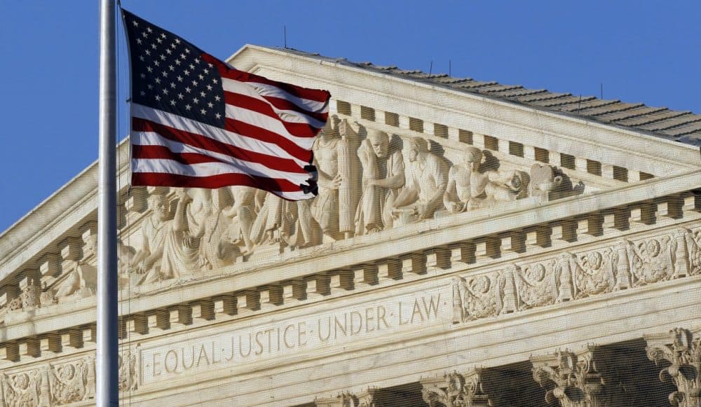 An American flag flies in front of the Supreme Court in Washington. (Alex Brandon/AP)