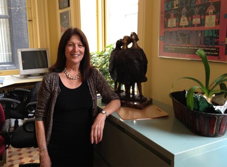 Outgoing director Geri Guardino takes a break from backing up the First Night offices on Friday. (Lynn Jolicouer/WBUR)